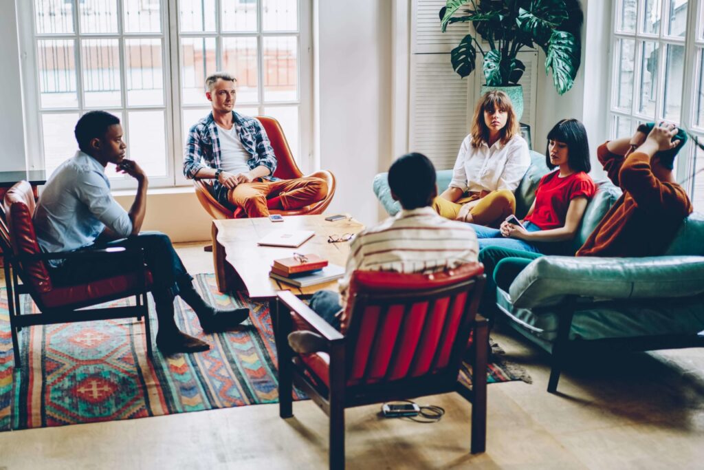 group of people sitting in a room