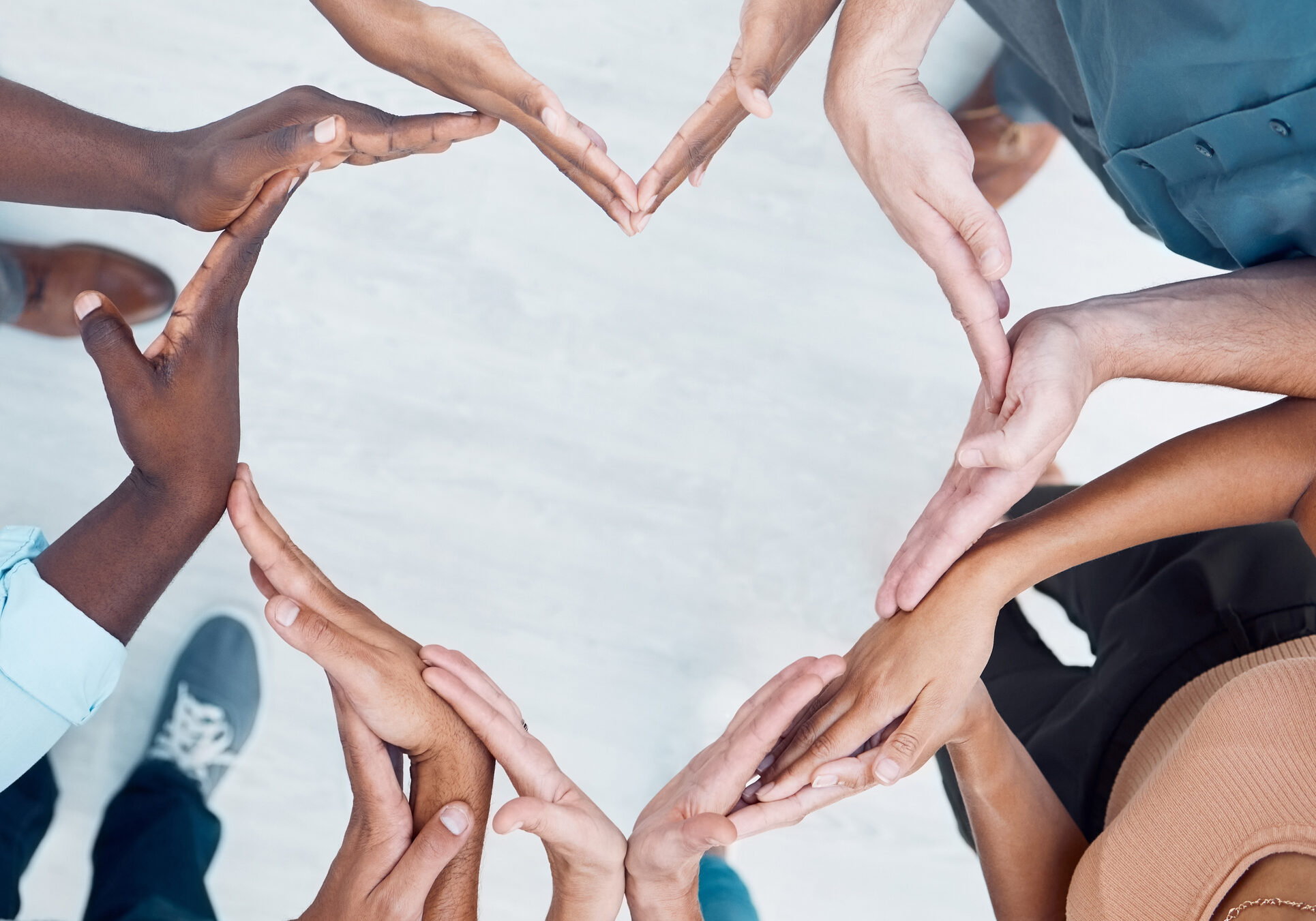 Teamwork hands, heart and diversity partnership, business people support or community care, motivation and trust. Above group team building for charity, kindness and global solidarity, love and hope